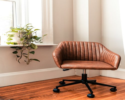 Modern ergonomic chair and desk setup near a window